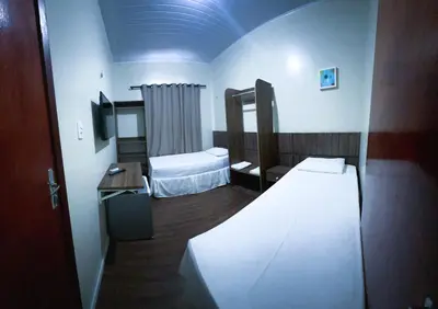 Uma cama ou camas num quarto em Pousada das Maracanãs