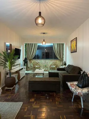 Uma área de estar em Apartamento Mobiliado Temporada