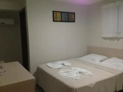 Uma cama ou camas num quarto em Hotel Litoral Fortaleza