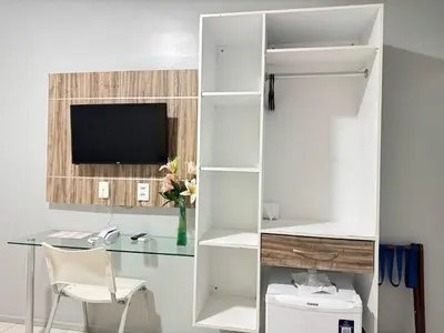 Uma televisão e/ou sistema de entretenimento em Hotel Aeroporto Star