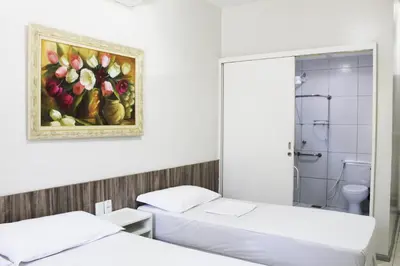 Uma cama ou camas num quarto em Hotel Aeroporto Star