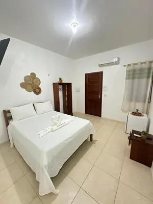 Uma cama ou camas num quarto em Morada da Praia Pousada