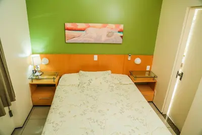 Uma cama ou camas num quarto em Belíssimo Apart com Vista Mar - Conforto a 100m da Orla