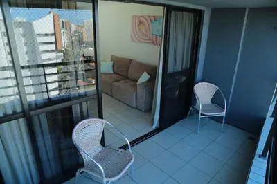 Uma área de estar em Belíssimo Apart com Vista Mar - Conforto a 100m da Orla