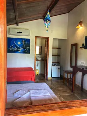 Uma cama ou camas num quarto em Pousada Icaraizinho Praia