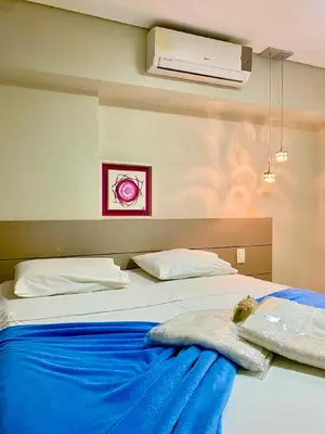 Uma cama ou camas num quarto em Apto. Novo Landscape Beira Mar