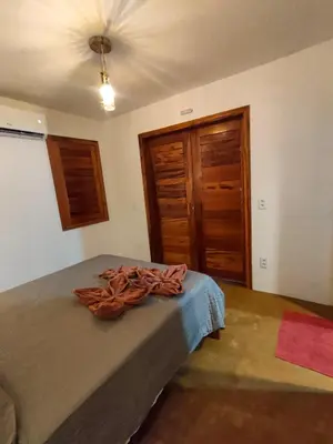 Uma cama ou camas num quarto em Icarai Kite House