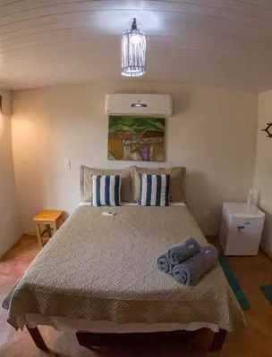 Uma cama ou camas num quarto em Icarai Kite House