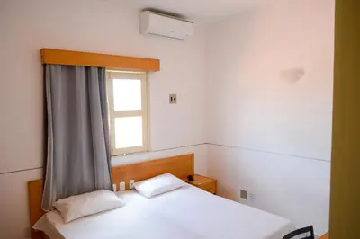 Uma cama ou camas num quarto em Hotel Villa Real