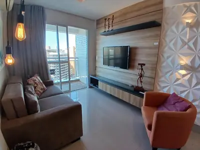 Uma televisão e/ou sistema de entretenimento em My Way Abolição Vista Mar by Escala Imóveis