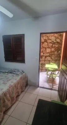 Uma cama ou camas num quarto em Suites Solar dos Arcanjos Guaramiranga