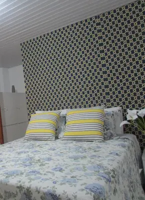 Uma cama ou camas num quarto em Pousada Casa da Adriana
