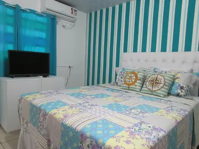 Uma cama ou camas num quarto em Pousada Casa da Adriana