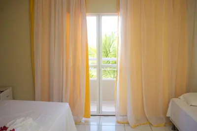 Uma cama ou camas num quarto em Pedacinho do Paraiso Pousada