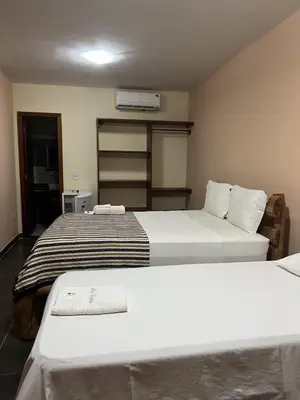 Uma cama ou camas num quarto em Hotel Alta Vista