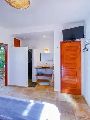Uma televisão e/ou sistema de entretenimento em BEACH VILLA Camurupim