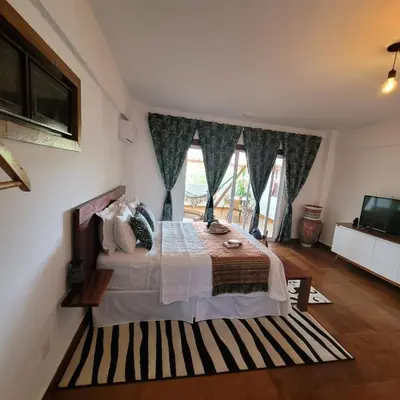 Uma cama ou camas num quarto em R.I.O
