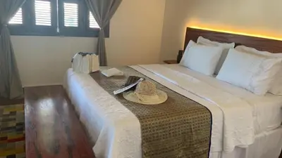 Uma cama ou camas num quarto em R.I.O