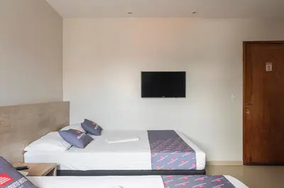 Uma cama ou camas num quarto em Mega Aeroporto Hotel Apenas 1 km de distância do Aeroporto de Fortaleza