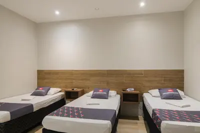 Uma cama ou camas num quarto em Mega Aeroporto Hotel Apenas 1 km de distância do Aeroporto de Fortaleza