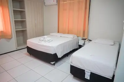Uma cama ou camas num quarto em Hotel Visconde