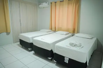 Uma cama ou camas num quarto em Hotel Visconde