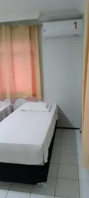 Uma cama ou camas num quarto em Hotel Visconde