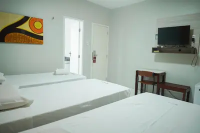 Uma cama ou camas num quarto em Hotel Visconde