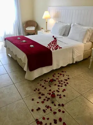 Uma cama ou camas num quarto em Hotel Montenegro Guaramiranga