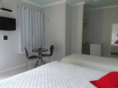 Uma cama ou camas num quarto em Fazenda Hotel Pedra dos Ventos