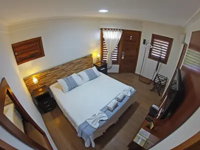 Uma cama ou camas num quarto em Hotel Vale das Nuvens