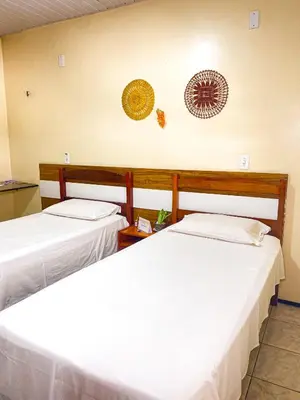 Uma cama ou camas num quarto em Hotel Monólitos
