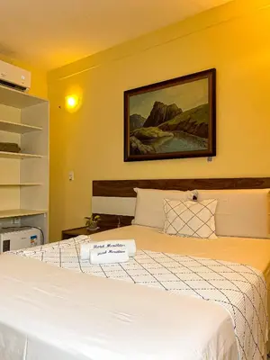 Uma cama ou camas num quarto em Hotel Monólitos