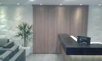 Uma área de estar em Flat Atlântico Meireles by Escala