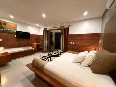 Uma televisão e/ou sistema de entretenimento em Pousada Oasis Paracuru