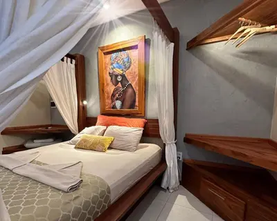 Uma cama ou camas num quarto em Pousada Oasis Paracuru