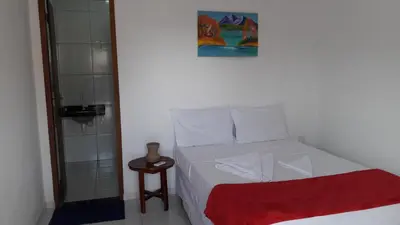 Uma cama ou camas num quarto em Villa Portal dos Ventos