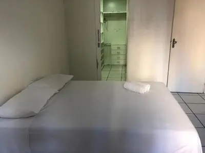 Uma cama ou camas num quarto em Porto de Iracema Residence CBT