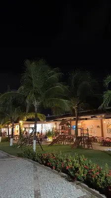 Um jardim no exterior de Hotel & Pousada Italia Beach - Porto Das Dunas