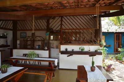 Uma área de estar em Pousada Bangalô