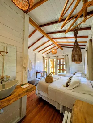 Uma cama ou camas num quarto em Pousada Villa del Lótus