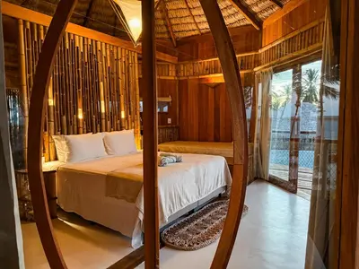Uma cama ou camas num quarto em BAMBU BLU Lagoon Homes - Ilha do Guajiru