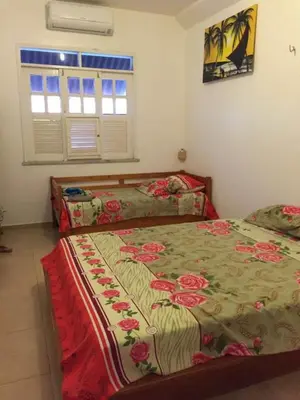 Uma cama ou camas num quarto em Mansão Triplex 10 Suítes a 150 metros do Mar e Beach Park