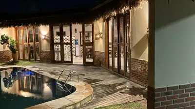 A piscina em ou perto de Mansão Rústica 10 Suítes a 150 metros do Mar e Beach Park