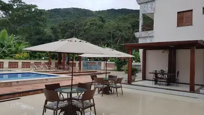 A piscina em ou perto de HOTEL CANTINHO DAS FLORES