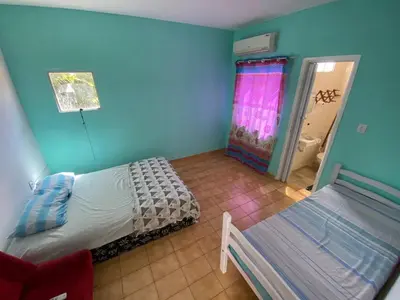Uma cama ou camas num quarto em Sol'Lar Pousada & Hostel