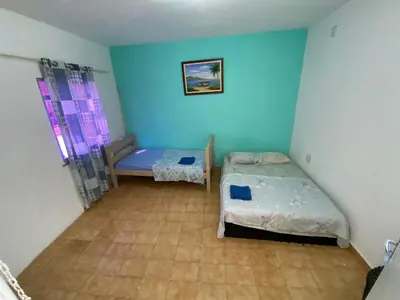 Uma cama ou camas num quarto em Sol'Lar Pousada & Hostel