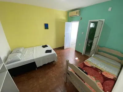 Uma cama ou camas num quarto em Sol'Lar Pousada & Hostel
