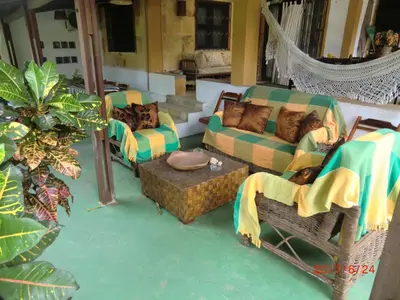 Uma área de estar em Pousada Yuste Beach Farm