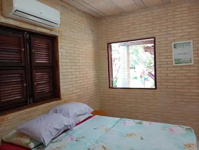 Uma cama ou camas num quarto em Casa das Gaúchas